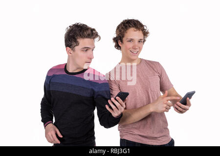 Portrait of a two happy young men using mobile phones Stock Photo