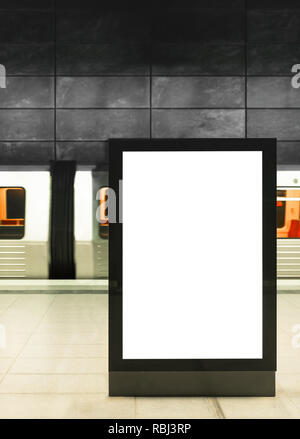 illuminated digital billboard in underground train station Stock Photo
