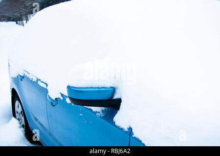 Snow on cars after snowfall. Winter urban scene Stock Photo
