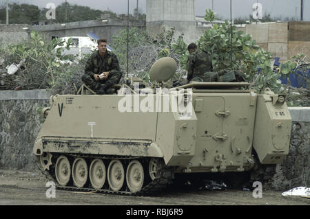 10th October 1993 Two U.S. Army soldiers sit on top of their M113 APC. They have just arrived at Mogadishu Airport in Somalia. Stock Photo