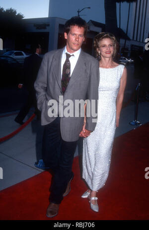 BEVERLY HILLS, CA - AUGUST 11: Actor Kevin Bacon and actress Kyra Sedgwick attend Universal Pictures' 'Heart And Souls' Premiere on August 11, 1993 at the Academy Theatre in Beverly Hills, California. Photo by Barry King/Alamy Stock Photo Stock Photo