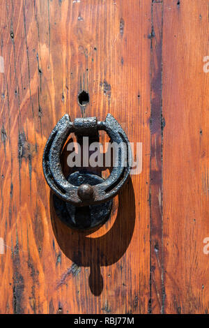 A door know on from a house on Vis Island, Croatia Stock Photo