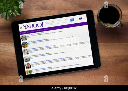 The Website Of Yahoo Is Seen On An Ipad Tablet Which Is Resting On A Wooden Table Editorial Use Only Stock Photo Alamy