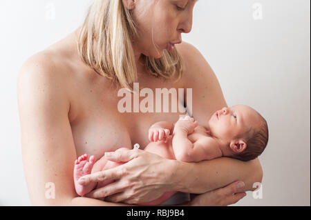 Mother holding newborn baby Stock Photo