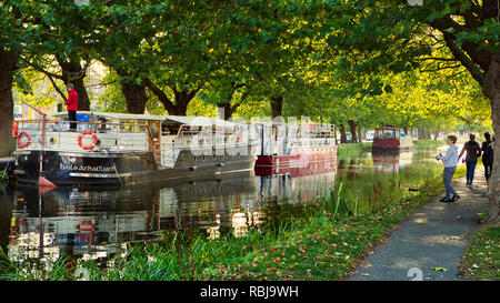 A young man fishing in the Grand Canal waterway in Dublin, Ireland. Stock Photo