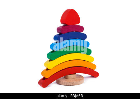 Photo colorful wooden constructor of small arcs, triangles and other forms of beech on a white isolated background Stock Photo
