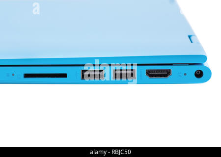 Part of a modern blue laptop with a power with two USB connectors, HDMI connector and SD card slot Stock Photo
