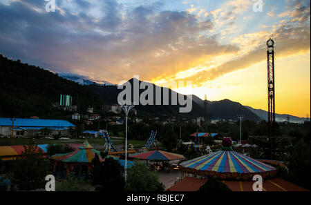 Children attractions on the background sunset in the city of Ramsar, northern Iran Stock Photo