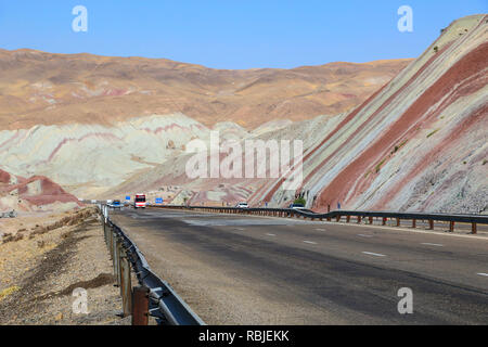 Cars driving on the highway through beautiful colorful mountains similar to eastern spices in Tabriz, Iran Stock Photo