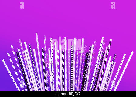 Colorful purple straws collections on pastel background.party and celebration ideas concepts Stock Photo