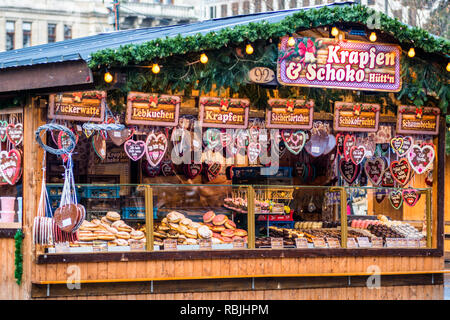 Heart-Shaped Gingerbread Cookies or Lebkuchen stall at Christmas market at Vienna's Rathaus, Austria. Stock Photo