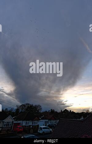 Dark rising storm clouds over suburban landscape Shepperton Surrey England UK Stock Photo