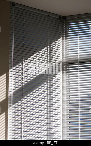 Light and shadows through window blinds Stock Photo