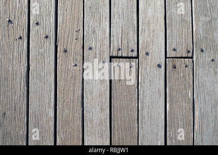 Surface from old vintage wooden boadrs fixed by metal nails front view close up Stock Photo
