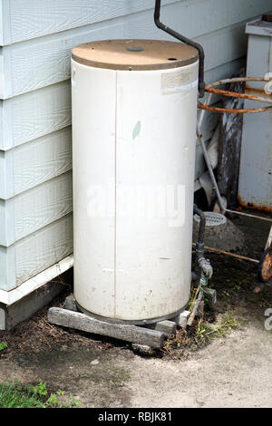 hot water system boiler old dumped in street Stock Photo - Alamy