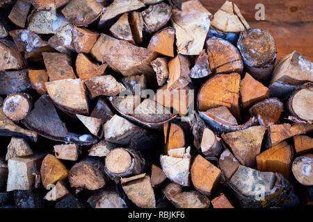 Wood stack for sauna and bathhouse in country house. Rustic wooden background Stock Photo