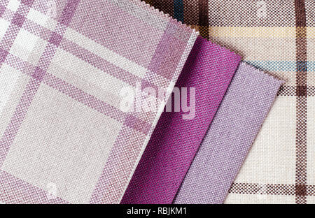Bright collection of colorful gunny textile samples. Fabric texture background Stock Photo