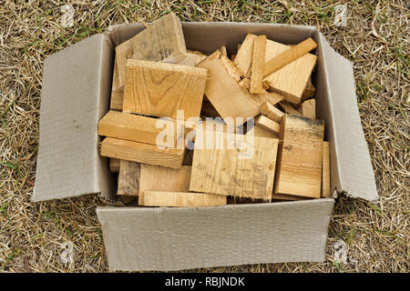 pile of timber blocks / off cuts used for arts and crafts in a box Stock Photo