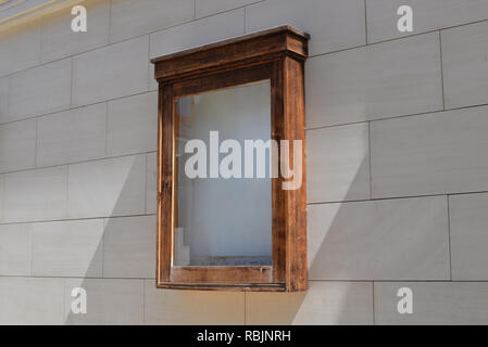 Empty theater, cinema poster advertising box on wall. Stock Photo