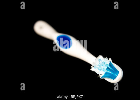 Toothbrush isolated on black background Stock Photo