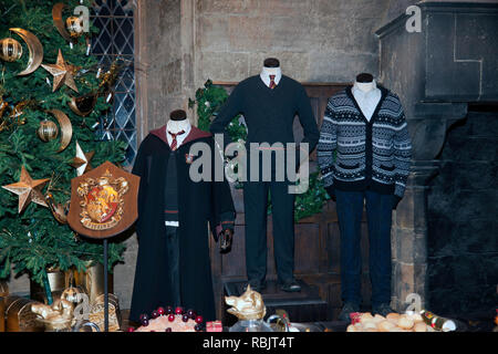 Gryffindor House Uniforms and crest, on display in the Great Hall, on the Making of Harry Potter Tour, Warner Brothers Studio's Stock Photo