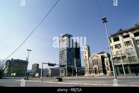 15th March 1993 During the Siege of Sarajevo: the Holiday Inn, Unis Towers and Saint Joseph's Church on a deserted Sniper Alley. Stock Photo