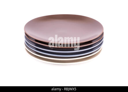 Stack of colorful plates isolated on white background. Stock Photo