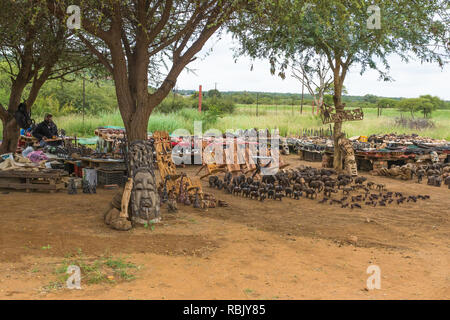 African souvenirs and momentos on display and for sale outside the entrance gate to Madikwe game reserve Northwest Province, South Africa Stock Photo