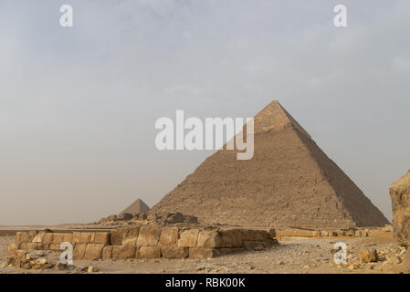 The Pyramid of Khafre or of Chephren[1] (Arabic: هرم خفرع, translit. haram ḵafraʿ, IPA: [haram xafraʕ]) is the second-tallest and second-largest of t Stock Photo