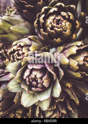 Beautiful background of purple artichokes, coming from organic cultivation. Flatlay view Stock Photo