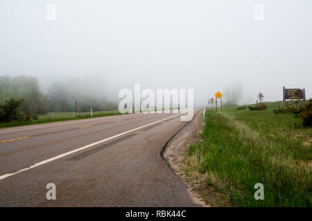 Marquette; Michigan.  Fog covers the road on highway 28 outside Marquette. Stock Photo