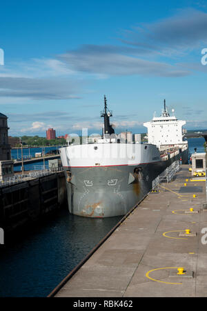 Sault Ste Marie, Michigan. The bulk carrier Kaministiqua going through the Soo Locks on the St. Mary's river heading out to Lake Superior to pickup a  Stock Photo