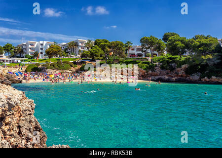Crowded beach Cala Esmeralda in Cala d'Or, Mallorca during summer season Stock Photo