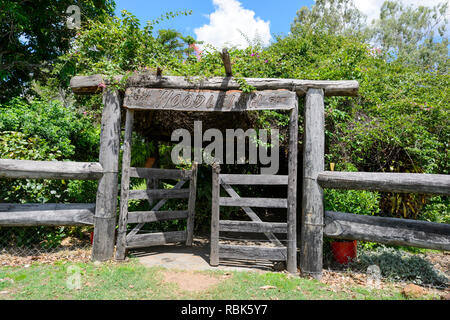 wooden rural gate near the old house on a spring day stock