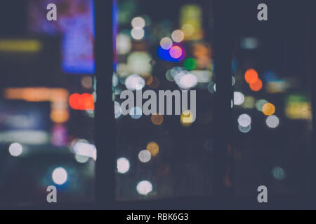 Blurred night lights through a window background for editing. Stock Photo