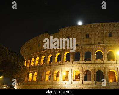 Colosseum by Night with full moon - Rome - Italy Stock Photo