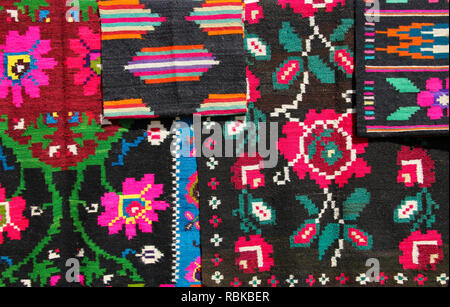 Old traditional romanian wool carpet with ancient motifs. Ethnic texture design. Stock Photo