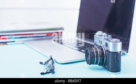 Computer keyboard, mouse and camera lie on table. Stock Photo