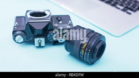 Computer keyboard, mouse and camera lie on table. Stock Photo