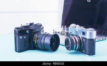 Computer keyboard, mouse and camera lie on table. Stock Photo