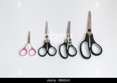 Various sizes of closed scissors isolated on white background. Stock Photo