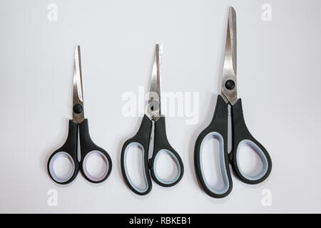 Various sizes of closed scissors isolated on white background. Stock Photo