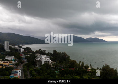 Aerial view of a tropical storm approaching Batu Ferringhi Beach and Penang National Park located in the Malacca Strait on Penang Island, Malaysia. Ba Stock Photo