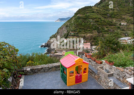 Child's pay house overlooking the coastline Stock Photo