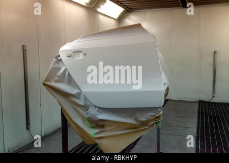 White door from the vehicle during the repair in the workshop for painting the car body Stock Photo