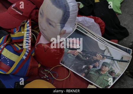 Caracas, Miranda, Venezuela. 10th Jan, 2019. Portraits of Hugo Chavez seen on the ground in city center.Venezuelan President Nicolas Maduro started a second term, defying critics in the United States and Latin America who called him an illegitimate usurper of a nation where economic chaos has wrought a humanitarian crisis. The National Assembly calls the Maduro government a ''dictatorship and usurpation of power.'' Currently Venezuela is experiencing its worst economic crisis with an inflation rate of over 1,000,000% Credit: Roman Camacho/SOPA Images/ZUMA Wire/Alamy Live News Stock Photo