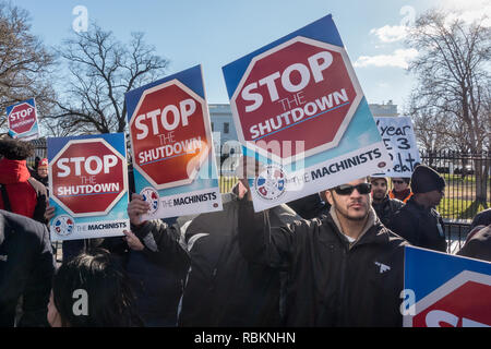Washington, DC, USA.  10th January, 2019. Protesting the partial government shutdown, hundreds of furloughed as well as unpaid working federal employees, and supporters marched to the White House after a rally outside the nearby AFL-CIO headquarters, where they heard from union leaders and members of congress calling for President Trump and Republican senate majority leader Mitch McConnell to end the shutdown. Bob Korn/Alamy Live News