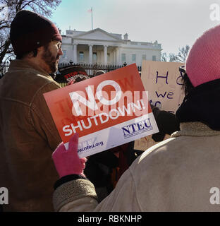Washington, DC, USA.  10th January, 2019. Protesting the partial government shutdown, hundreds of furloughed as well as unpaid working federal employees, and supporters marched to the White House after a rally outside the nearby AFL-CIO headquarters, where they heard from union leaders and members of congress calling for President Trump and Republican senate majority leader Mitch McConnell to end the shutdown. Bob Korn/Alamy Live News Stock Photo
