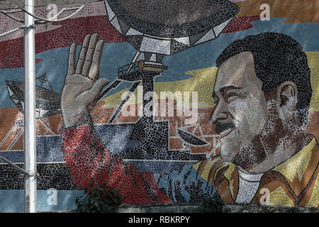 Caracas, Miranda, Venezuela. 10th Jan, 2019. A wall with the face of Nicolas Maduro in Caracas.Venezuelan President Nicolas Maduro started a second term, defying critics in the United States and Latin America who called him an illegitimate usurper of a nation where economic chaos has wrought a humanitarian crisis. The National Assembly calls the Maduro government a ''dictatorship and usurpation of power.'' Currently Venezuela is experiencing its worst economic crisis with an inflation rate of over 1,000,000% Credit: Roman Camacho/SOPA Images/ZUMA Wire/Alamy Live News Stock Photo