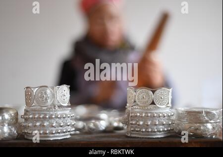 Qiandongnan. 11th Jan, 2019. A craftswoman makes silver accessories in Kaili City, southwest China's Guizhou Province, Jan. 10, 2019. People are busy making silver handicrafts for the upcoming Spring Festival, which starts from the first day of the first month of the Chinese lunar calendar, or Feb. 5 this year. Credit: Xinhua/Alamy Live News Stock Photo